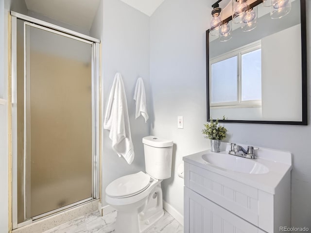 bathroom with toilet, vanity, and walk in shower