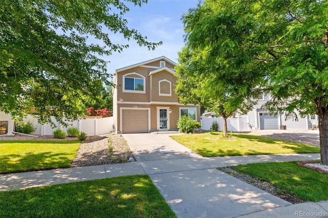 18672 E Chaffee Pl, Denver, CO 80249 - view of front facade featuring stucco siding, driveway, and an attached garage