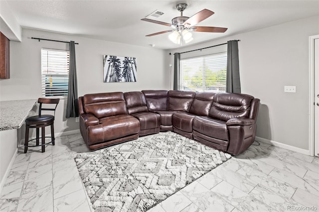 18672 E Chaffee Pl, Denver, CO 80249 - living area with marble finish flooring and ceiling fan