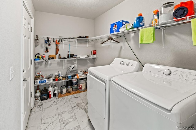 18672 E Chaffee Pl, Denver, CO 80249 - laundry room with independent washer and dryer, light marble finish floors, and a textured ceiling