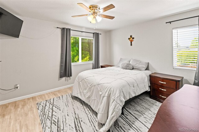18672 E Chaffee Pl, Denver, CO 80249 - bedroom featuring light wood finished floors and a ceiling fan