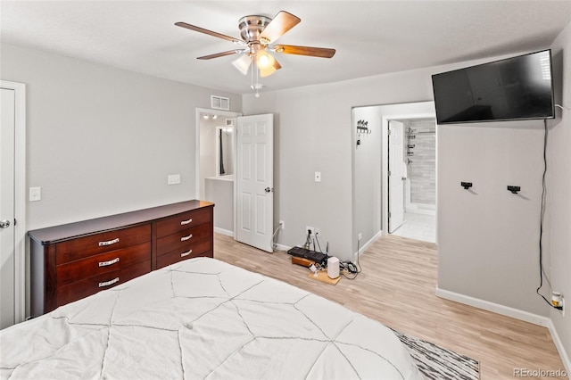 18672 E Chaffee Pl, Denver, CO 80249 - bedroom with light wood-style floors, a ceiling fan, and connected bathroom