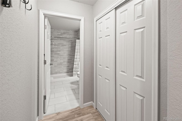 18672 E Chaffee Pl, Denver, CO 80249 - hallway featuring light wood-type flooring and a textured wall