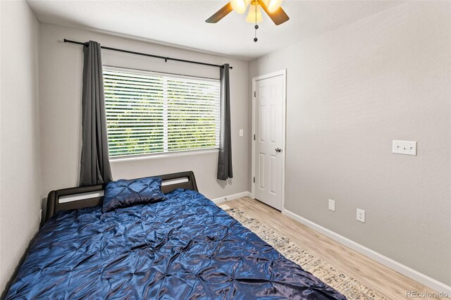 18672 E Chaffee Pl, Denver, CO 80249 - bedroom with wood finished floors and a ceiling fan