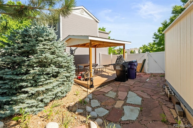 18672 E Chaffee Pl, Denver, CO 80249 - view of patio featuring a gate and a wooden deck