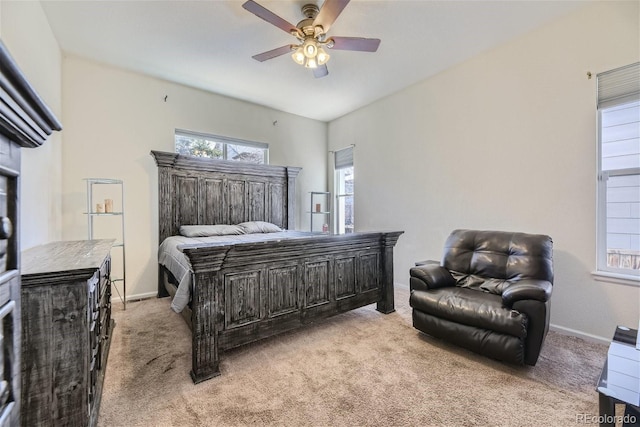 bedroom featuring ceiling fan and light colored carpet