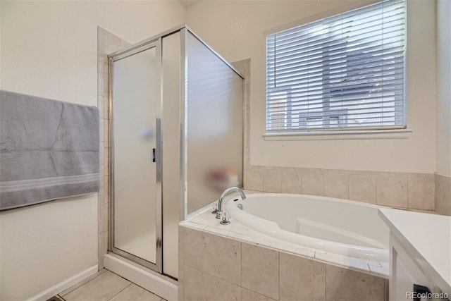 bathroom with vanity, independent shower and bath, and tile patterned flooring