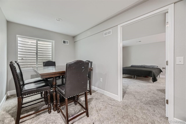 dining area with light carpet