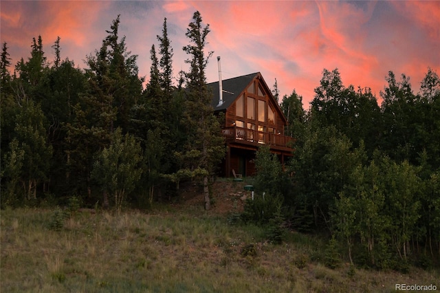 rear view of house with a wooden deck