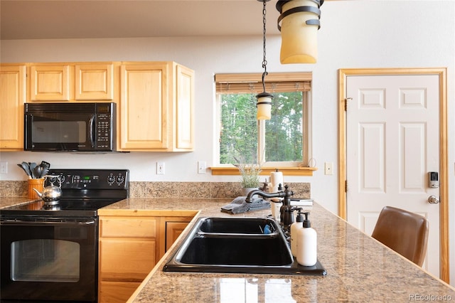 kitchen featuring a sink, decorative light fixtures, black appliances, and light brown cabinets