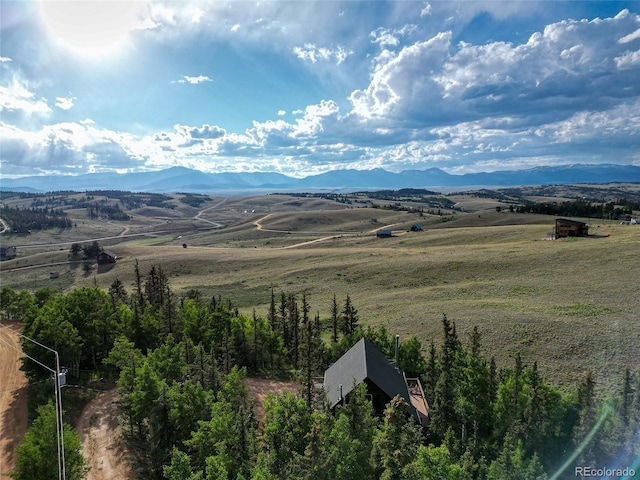 mountain view featuring a rural view