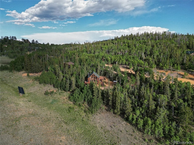 aerial view featuring a forest view