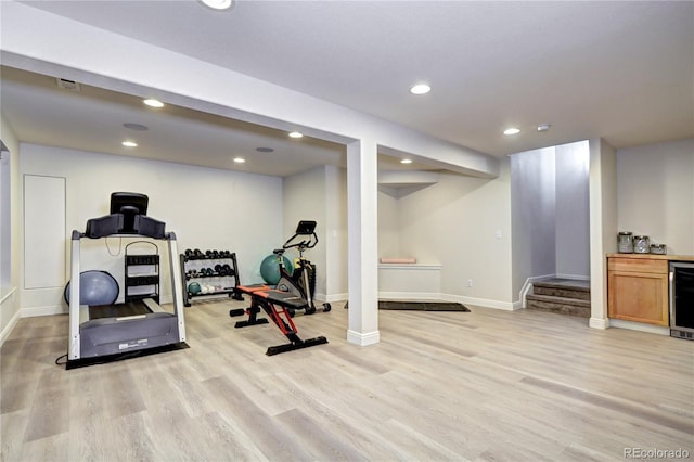 15160 W Iliff Pl, Lakewood, CO 80228 - exercise area with light wood-style flooring, recessed lighting, wine cooler, and a dry bar