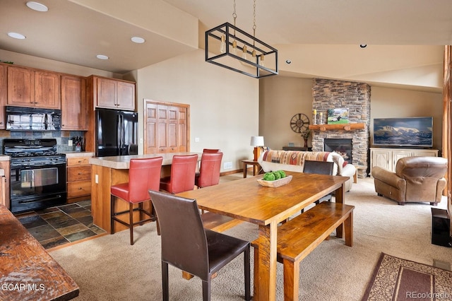45 County Road 5223 Unit 25B, Tabernash, CO 80478 - dining area with dark colored carpet, recessed lighting, and a stone fireplace