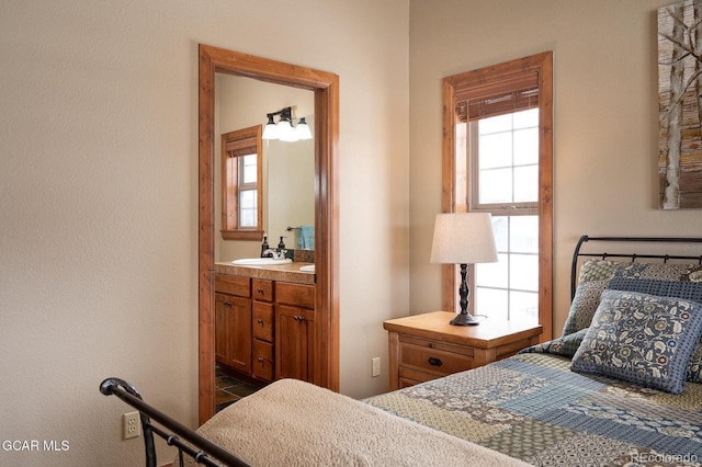 45 County Road 5223 Unit 25B, Tabernash, CO 80478 - bedroom featuring a sink and connected bathroom