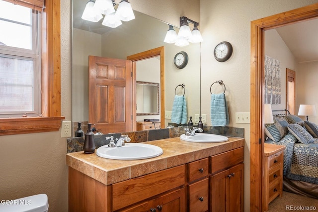 45 County Road 5223 Unit 25B, Tabernash, CO 80478 - bathroom featuring a chandelier, double vanity, and lofted ceiling