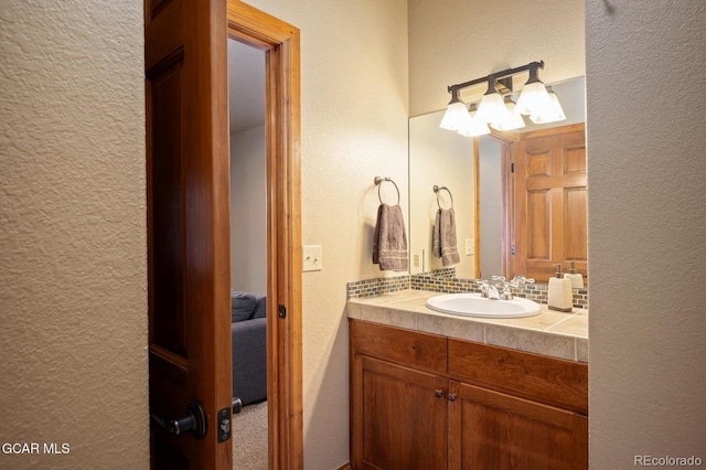 45 County Road 5223 Unit 25B, Tabernash, CO 80478 - ensuite bathroom featuring a textured wall and vanity