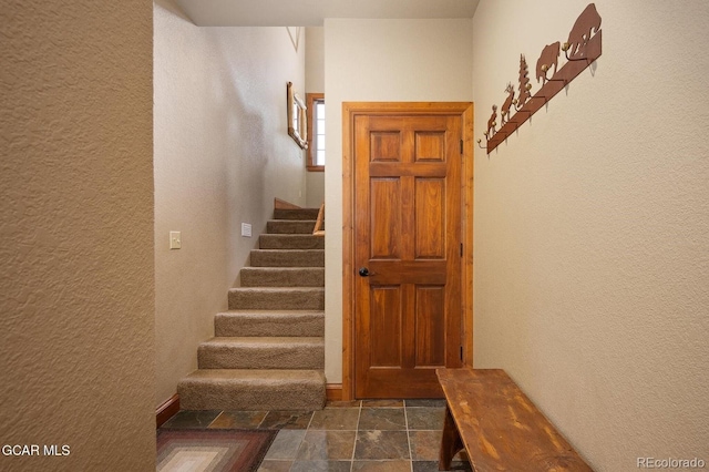 45 County Road 5223 Unit 25B, Tabernash, CO 80478 - stairs with a textured wall and stone finish flooring