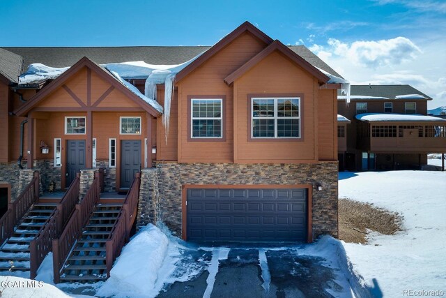 45 County Road 5223 Unit 25B, Tabernash, CO 80478 - craftsman inspired home featuring stone siding, an attached garage, and driveway