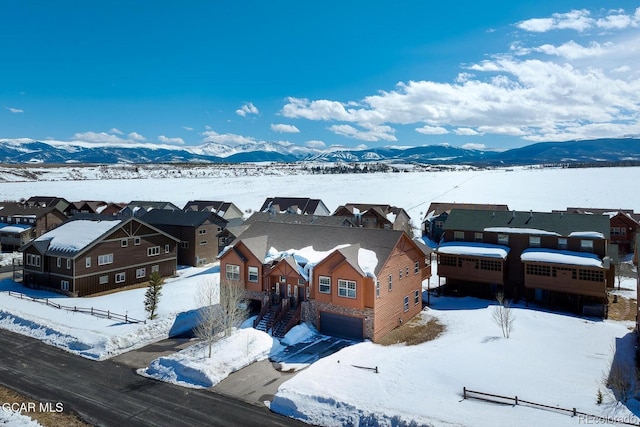 45 County Road 5223 Unit 25B, Tabernash, CO 80478 - snowy aerial view with a residential view and a mountain view