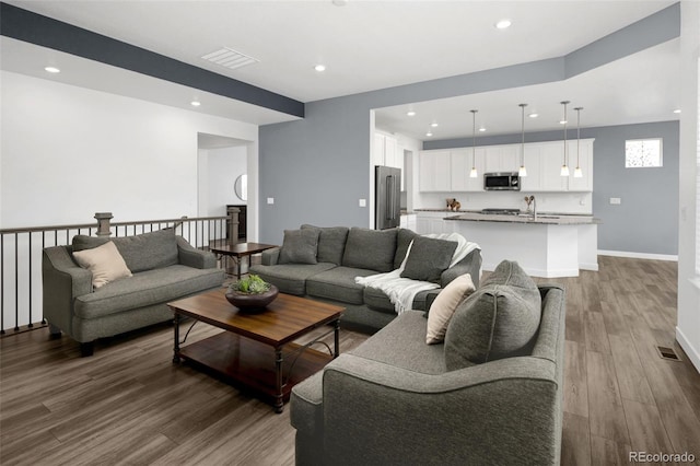 5128 Preserve Pl, Firestone, CO 80504 - living area featuring wood finished floors and recessed lighting