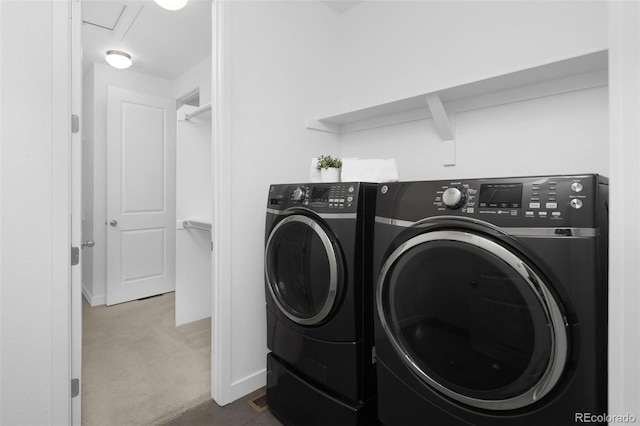 5128 Preserve Pl, Firestone, CO 80504 - laundry room featuring washing machine and clothes dryer and dark carpet