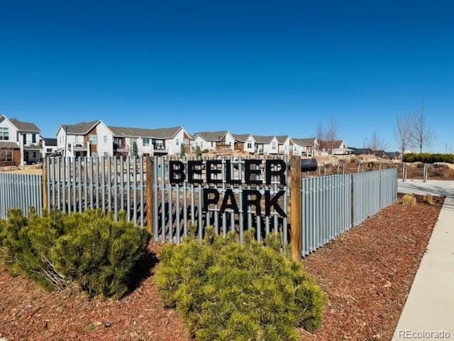 exterior space with fence and a residential view