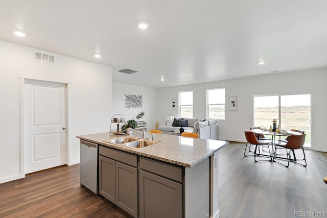 kitchen with visible vents, dishwasher, gray cabinetry, and a sink