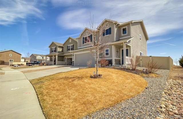 craftsman-style house with concrete driveway, a residential view, fence, and a garage