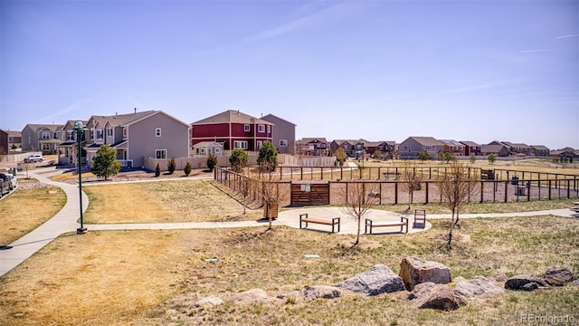 exterior space with a residential view and fence