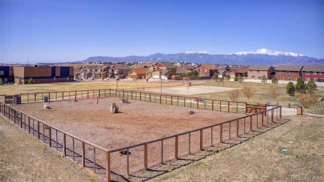 exterior space with a mountain view and a residential view