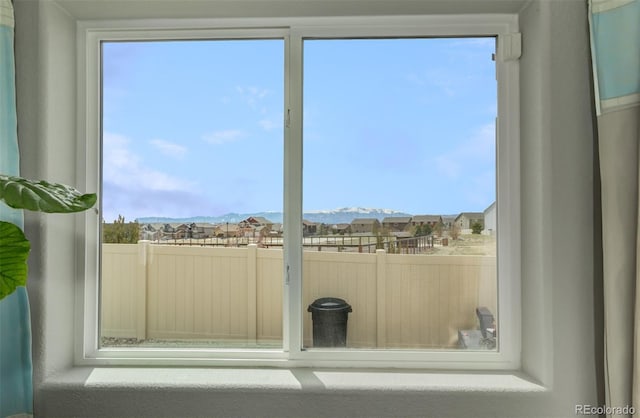 doorway to outside featuring a mountain view