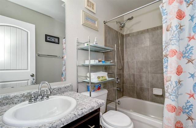 bathroom featuring toilet, visible vents, shower / tub combo with curtain, and vanity
