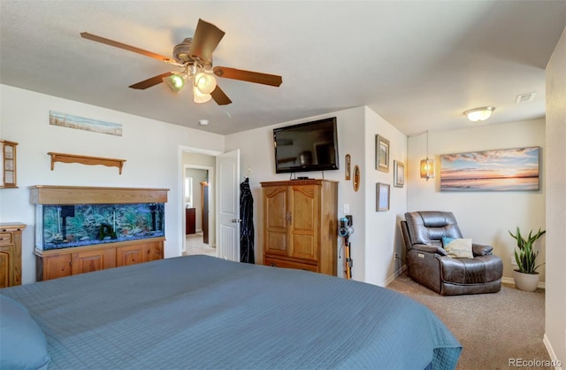 carpeted bedroom featuring ceiling fan, baseboards, and visible vents