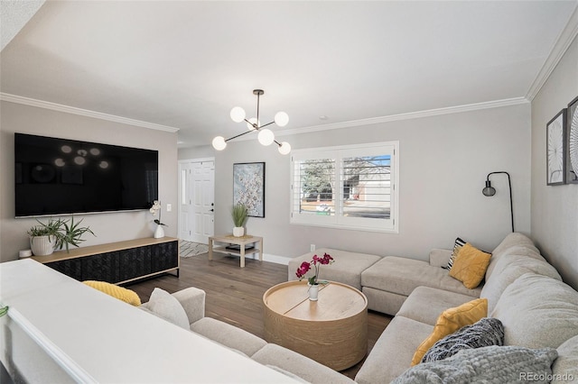 living area featuring wood finished floors, baseboards, a chandelier, and ornamental molding