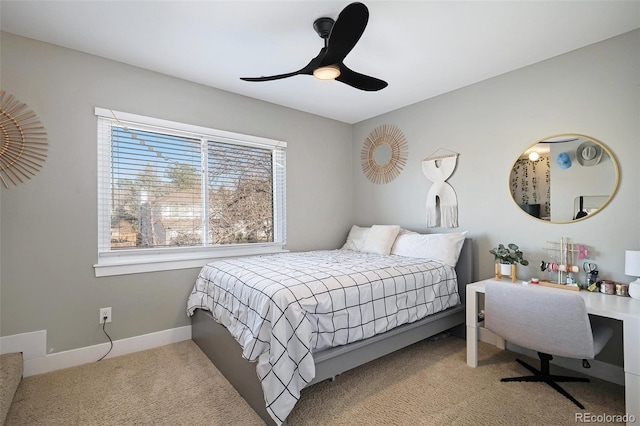 carpeted bedroom featuring a ceiling fan and baseboards