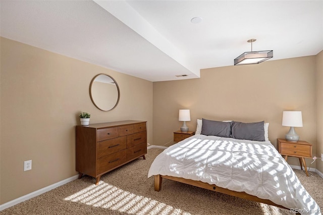 bedroom featuring light carpet, visible vents, and baseboards