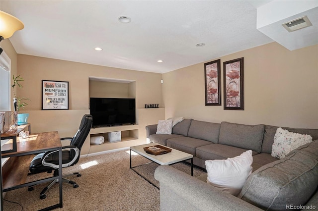 living area with recessed lighting, visible vents, and carpet floors