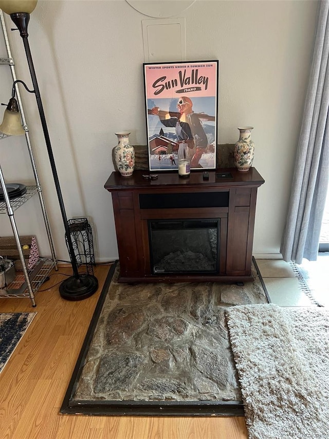 interior details featuring a glass covered fireplace