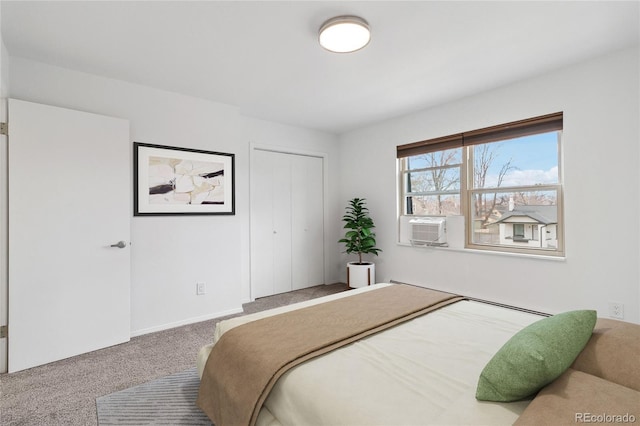 bedroom featuring carpet, cooling unit, and a closet