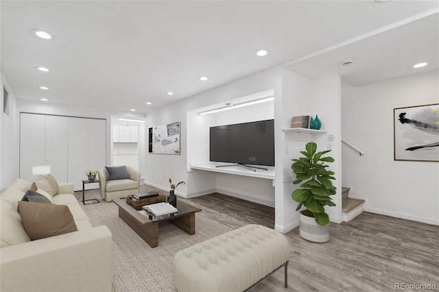 living room with light hardwood / wood-style flooring