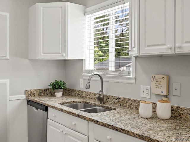 4858 S Quintero Cir, Aurora, CO 80015 - kitchen with dishwasher, a sink, white cabinetry, and plenty of natural light