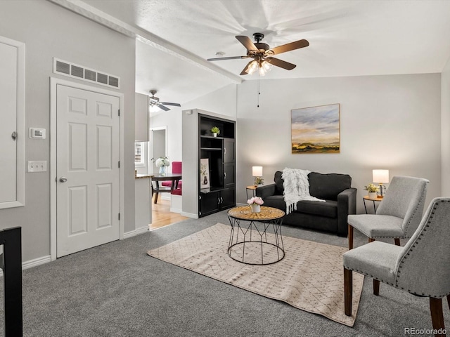 4858 S Quintero Cir, Aurora, CO 80015 - living area with ceiling fan, light colored carpet, vaulted ceiling, and baseboards