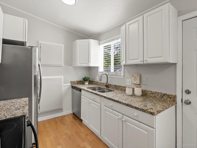 4858 S Quintero Cir, Aurora, CO 80015 - kitchen featuring a sink, stainless steel appliances, white cabinetry, and light wood finished floors