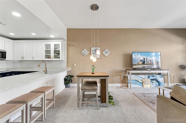 6000 W Floyd Ave Unit 214, Denver, CO 80227 - dining space with light colored carpet and recessed lighting