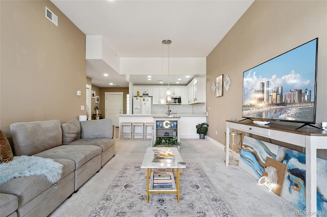 6000 W Floyd Ave Unit 214, Denver, CO 80227 - living area with light colored carpet and recessed lighting