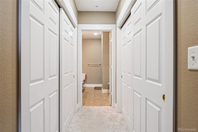 6000 W Floyd Ave Unit 214, Denver, CO 80227 - corridor with light colored carpet and baseboards