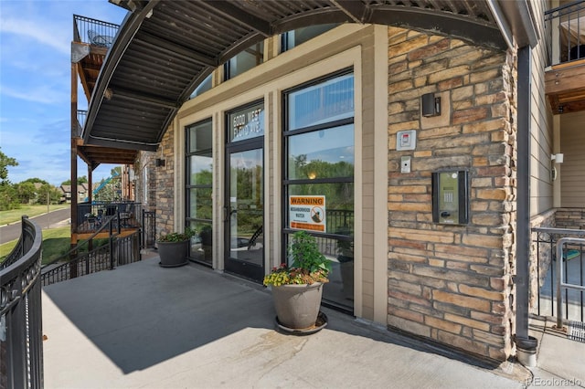 6000 W Floyd Ave Unit 214, Denver, CO 80227 - property entrance featuring stone siding