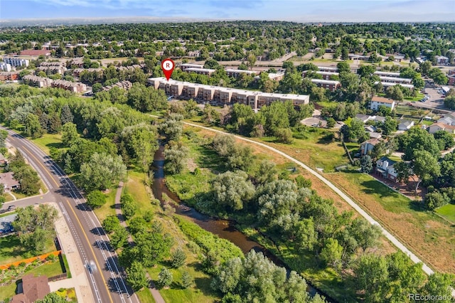 6000 W Floyd Ave Unit 214, Denver, CO 80227 - aerial view of property and surrounding area featuring a tree filled landscape