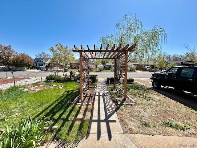 view of yard featuring a pergola and fence